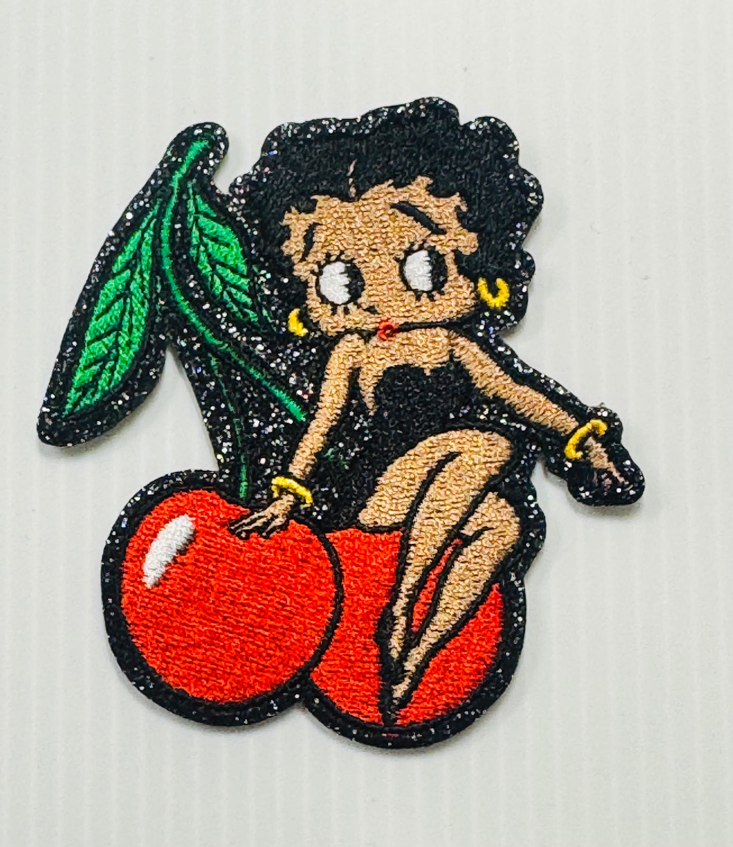 BETTY BOOP SITTING ON A CHERRY