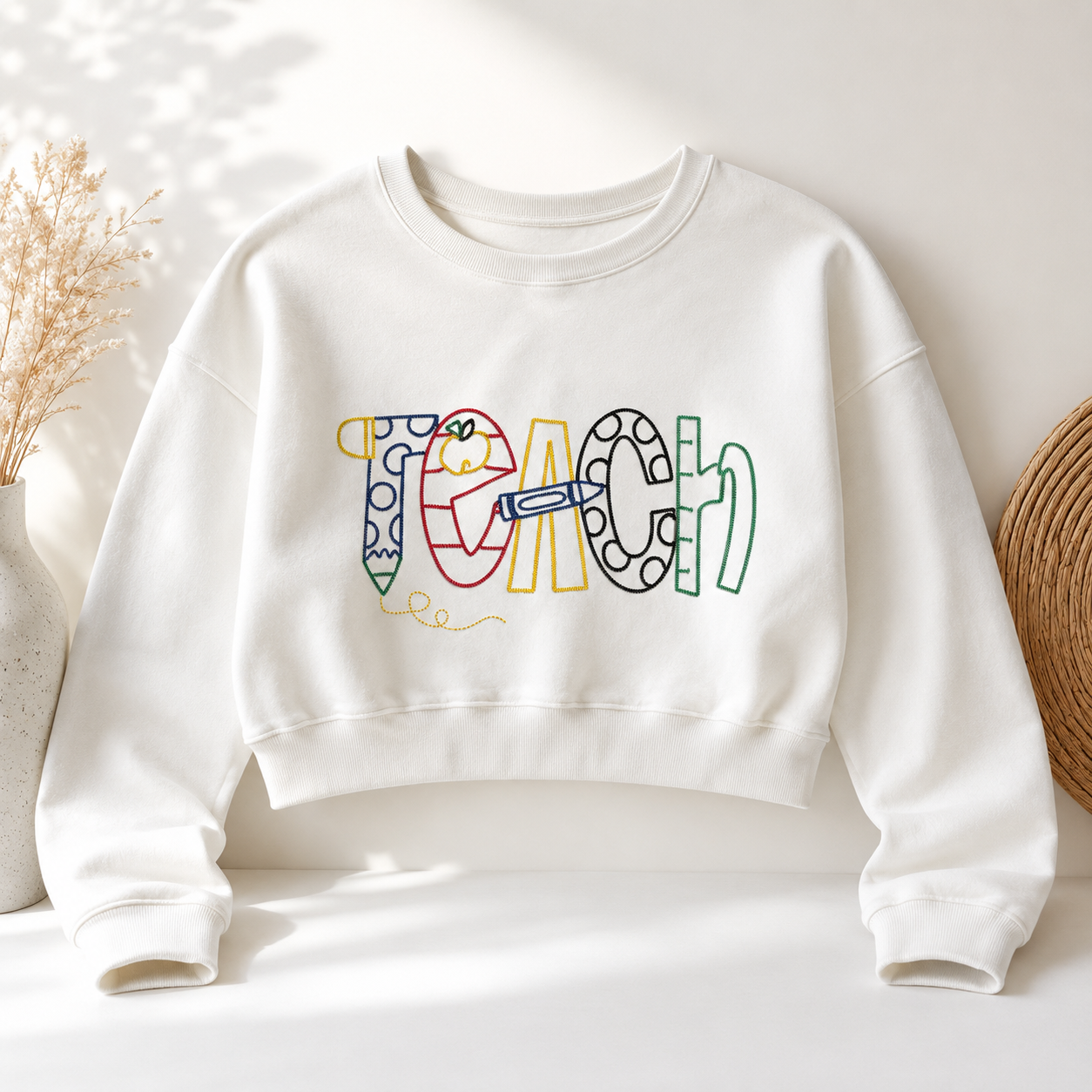 Teach Embroidered Cropped Teacher Sweatshirt