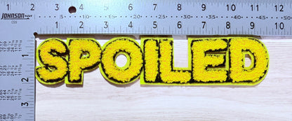 Spoiled chenille block letter patch